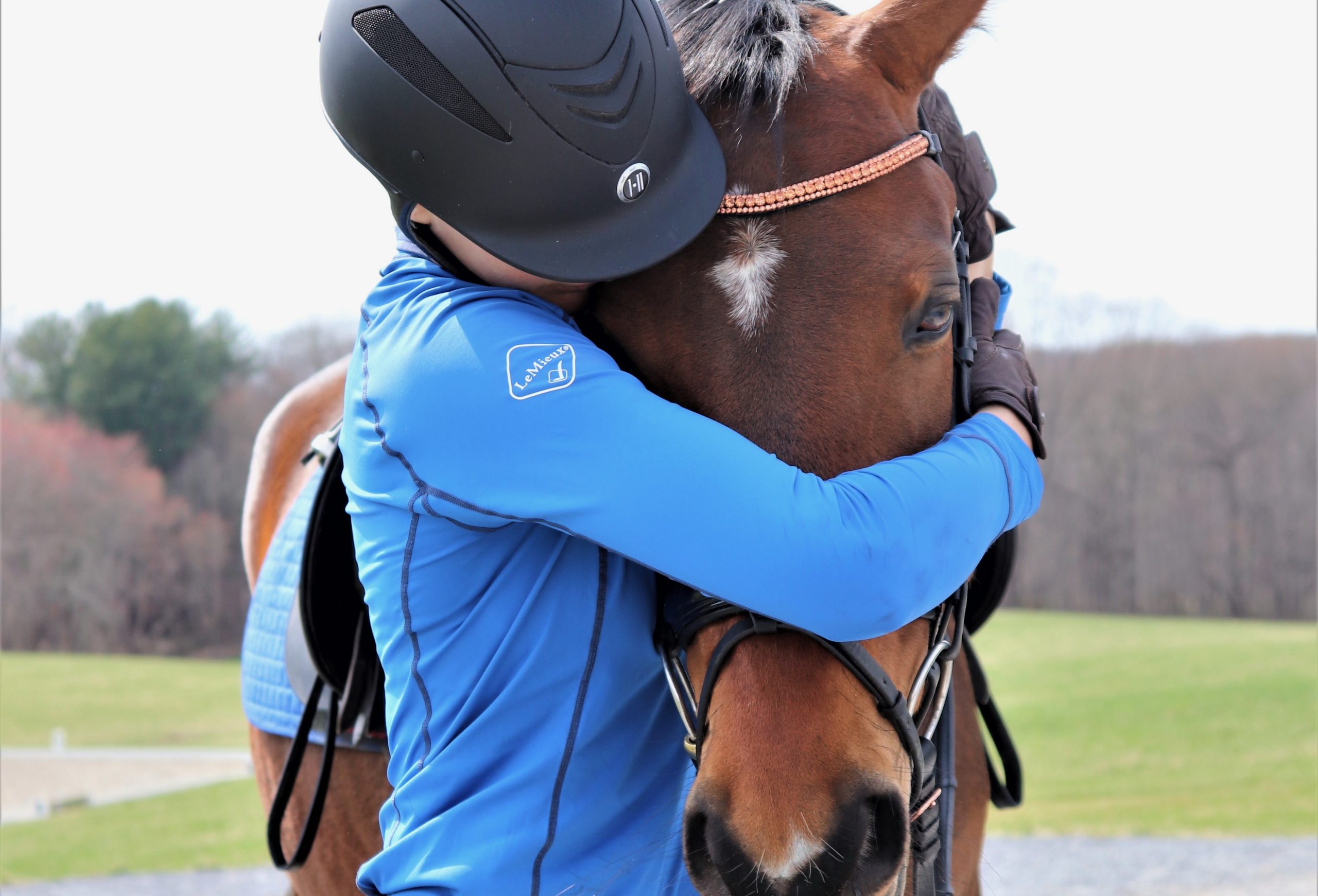 Aria-and-Larisa-Quirk-share-a-hug_courtesy-of-Days-End-Farm-Horse-Rescue-and-Larisa-Quirk-scaled
